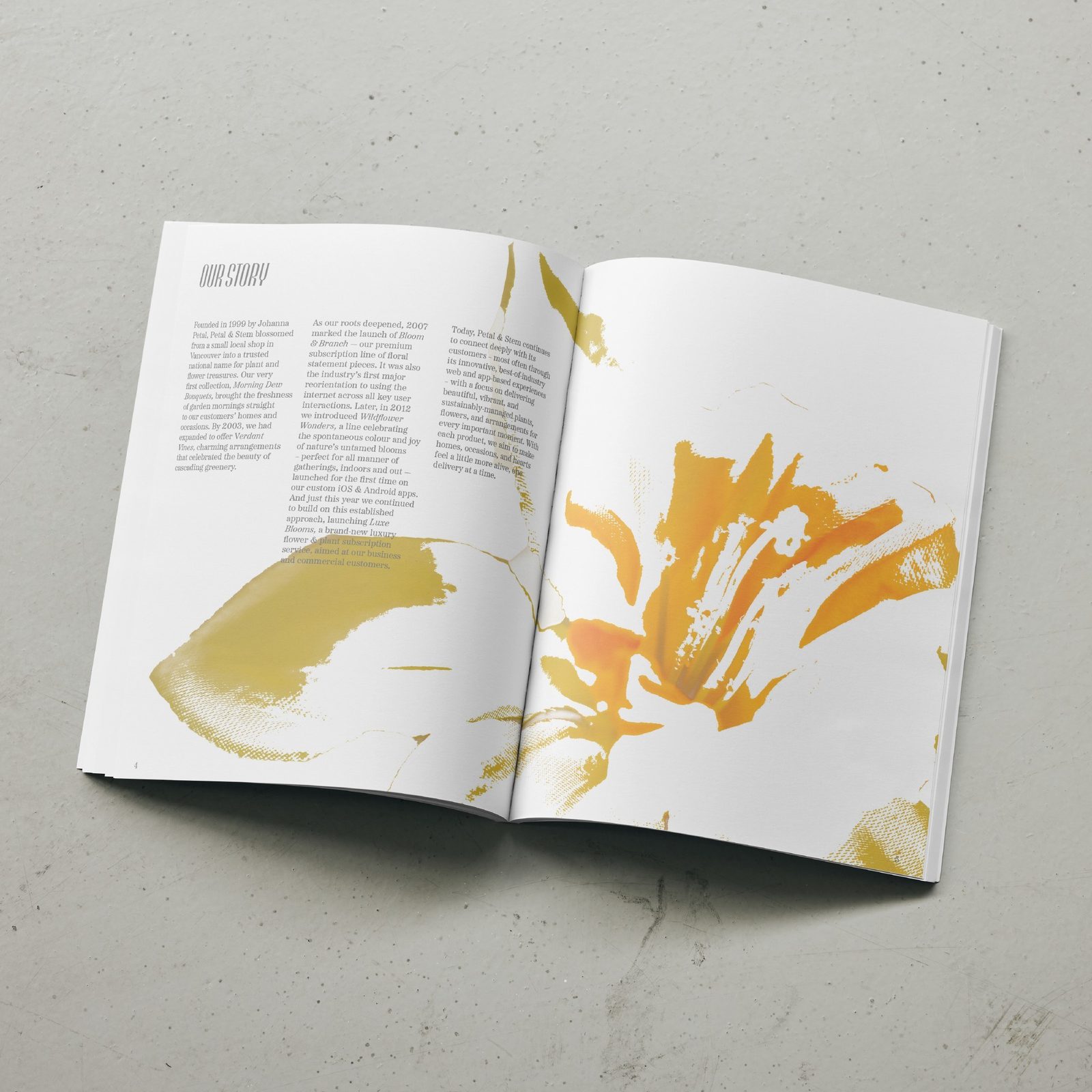 Petal and Stem Our Story spread with a large golden flower painting